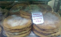 Artisan tortas de aceite ('olive oil flat cakes') at display on a patisserie of Seville (Spain)